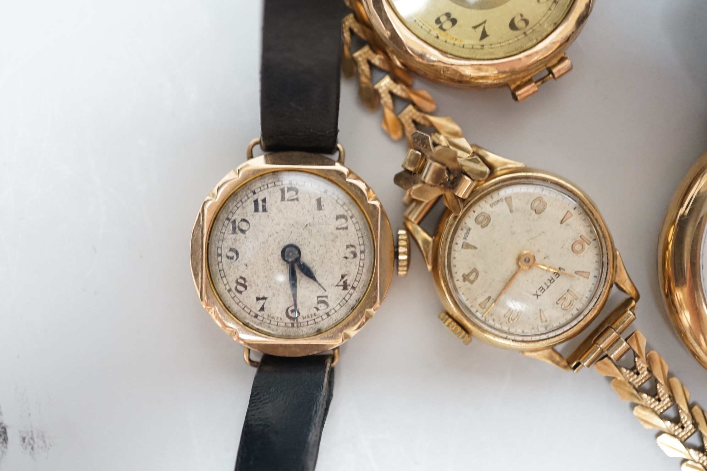 A lady's 9ct gold Timex manual wind wrist watch, on a 9ct gold bracelet, gross weight 1.8 grams and three other yellow metal wrist watches including a 9ct gold Waltham.